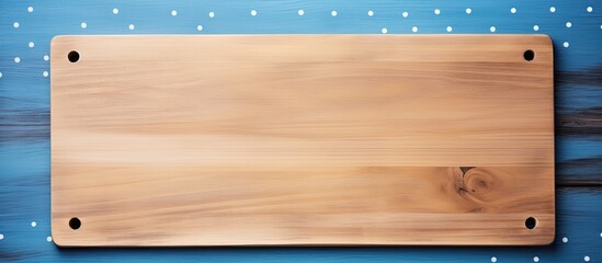 A blue wooden background in a cafe with a cutting board frame placed on a tablecloth filled with polka dots leaving space for a copy image. Creative banner. Copyspace image - Powered by Adobe