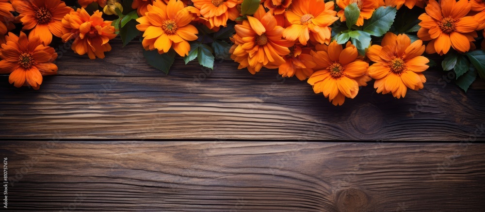 Poster a vibrant arrangement of orange flowers contrasting against rustic wooden boards creating a visually