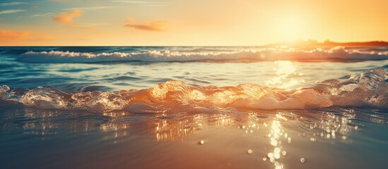 The image features a hazy sunset on a tropical beach with the sunlight creating a bokeh effect on the water It evokes the idea of a summer vacation and travel adventure with a vintage tone filter add