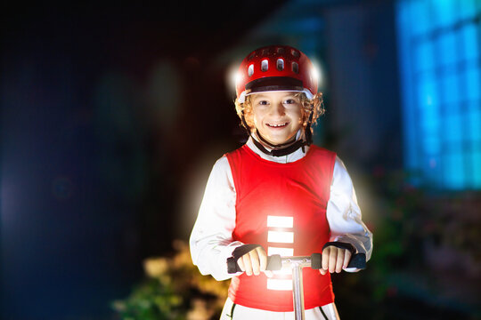 Safety on dark street. Kids reflective vest.