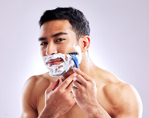 Portrait, man and shaving with razor for skincare, health or hair removal for hygiene isolated on...