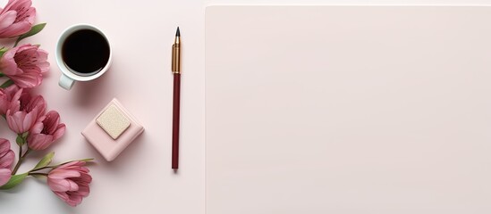 A top view copy space image of a feminine workspace showcasing a pencil lipstick and notepad The flat lay composition provides an overhead perspective from above