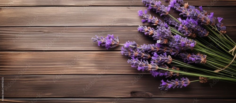 Poster a top down view of fresh lavender bouquet with wood as the background creates a captivating copy spa