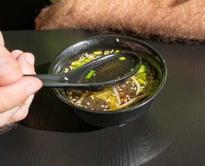 Fish Broth with Greens, Sesame Seeds and Herbs