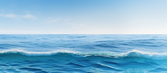 Fototapeta premium A serene expansive ocean with clear blue waves and a natural backdrop perfect for adding images or text. Creative banner. Copyspace image