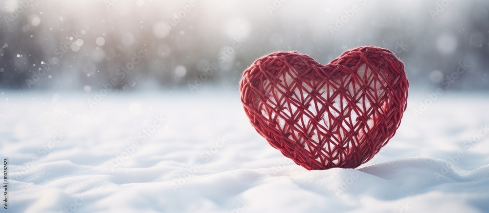 Poster A copy space image of a heart shaped wicker decoration resting on a blanket of pristine snow