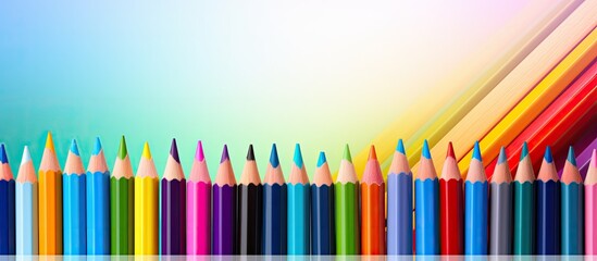 A colorful background with pencils creates a creative education concept providing a copy space image