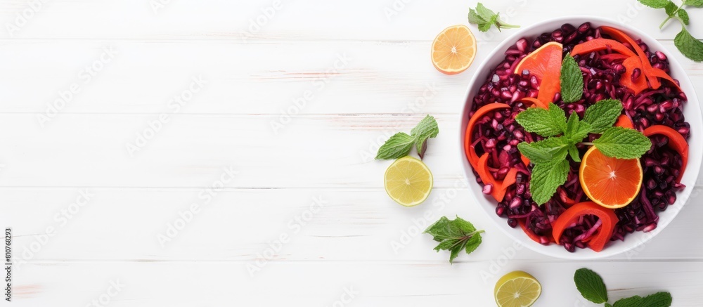Poster Top view of a detox salad made with red cabbage carrots and pomegranate accompanied by a flavorful cilantro dressing Presented on a white wooden background with ample space for copy