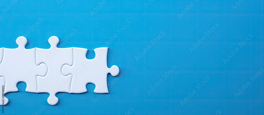 Poster A white jigsaw puzzle on a blue background with blank space for an image. Creative banner. Copyspace image