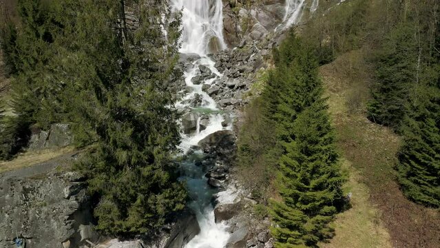 Nardis Waterfall, Trentino, Italian Alps, Italy. Aerial drone descending and tilt-up reveal