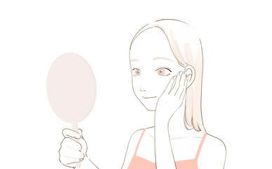 手を添えて鏡を見る女性