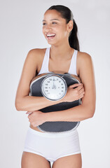 Girl, laugh and scale in studio for weight loss, smile and excited for results of diet or detox....