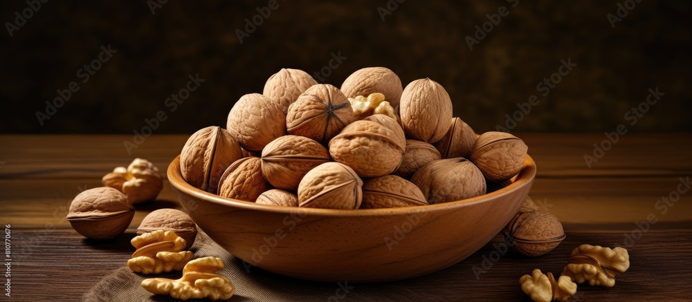 Poster A bowl containing a mixture of walnuts and peanuts with plenty of space for a copy space image
