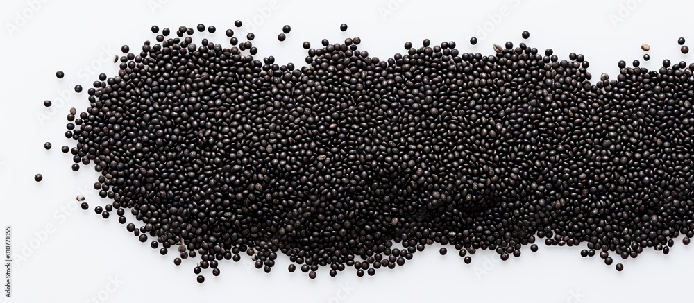 Poster Top view of black quinoa seeds on a white background with ample space for your text in the image