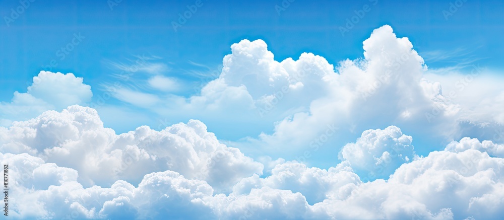 Poster A wide background with a blue sky and fluffy clouds perfect for a summer template or backdrop image with copy space