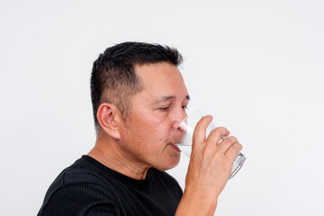 Middle-aged Asian man drinking cold water, isolated on white background