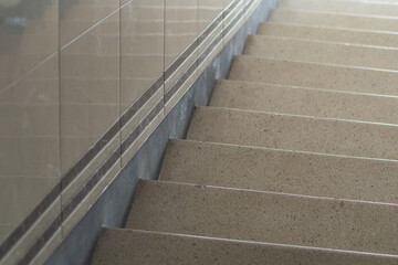 Fototapeta premium Detailed View of a Granite Staircase With Metal Handrail Inside a Building