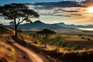Naklejka premium Nicaragua landscape. Tranquil Sunset Landscape with Dirt Road Winding Through Rolling Hills.