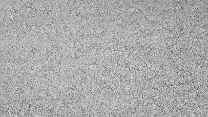 showing the detailed texture of a gray asphalt road surface