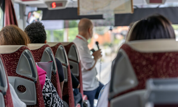 View of the passengers inside a stage coach bus. Bus interior trip. Transport, tourism and road trip concept.