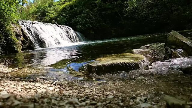 Discover tranquility with this HD slow-motion video of a gentle waterfall, perfect for relaxation and nature-themed projects.
This place is called "cascatelle" and we are at Cingoli - Italy