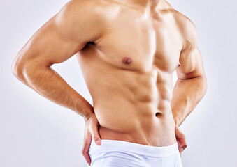 Abdomen, muscle and man in underwear on studio, white background or mockup of bodybuilder chest....