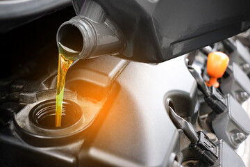 Refueling and pouring oil quality into the engine motor car Transmission and Maintenance Gear...