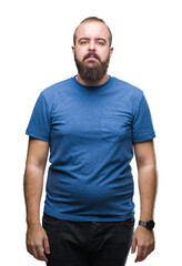 Fototapeta premium Young caucasian hipster man over isolated background with serious expression on face. Simple and natural looking at the camera.