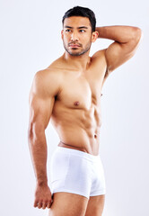 Studio, fitness and man in underwear with muscle on white background or mockup of bodybuilder....