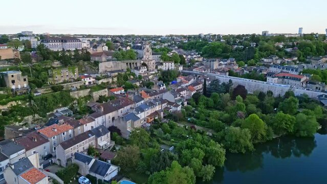 Poitiers cityscape with Clain River and Coligny-Cornet school in background, France. Aerial forward