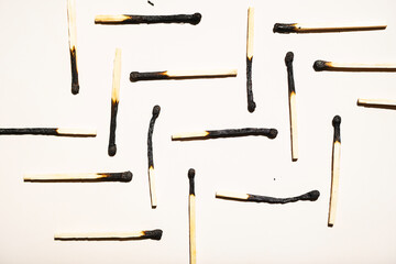 Geometric pattern from burnt matches.