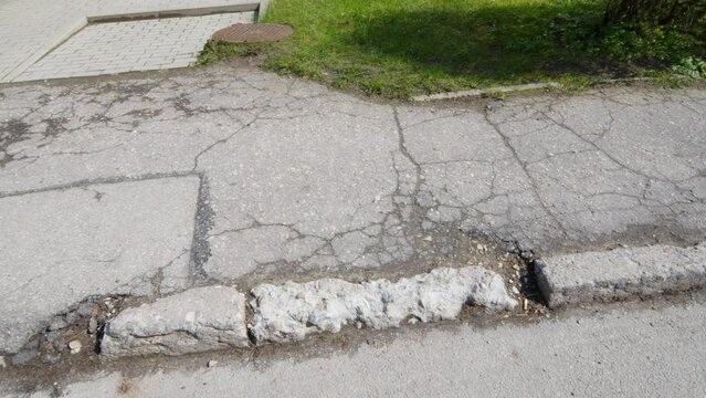 Deteriorating Gray Asphalt Footpath, Disappeared Verges, Potholes in Road, Poor Public Maintenance by Government