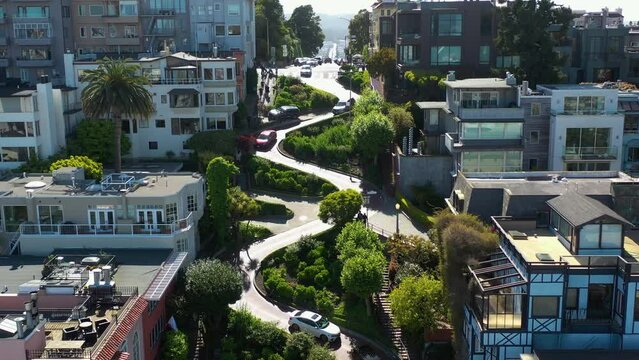 Drone rising over cars on the Lombard street, sunny day in San Francisco, USA