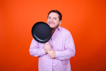 Joy, surprise and anger. Funny adult man posing in studio against orange background.