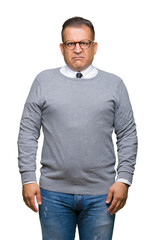 Fototapeta premium Middle age bussines arab man wearing glasses over isolated background skeptic and nervous, frowning upset because of problem. Negative person.
