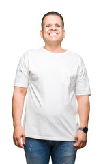 Middle age arab man wearig white t-shirt over isolated background with a happy and cool smile on face. Lucky person.