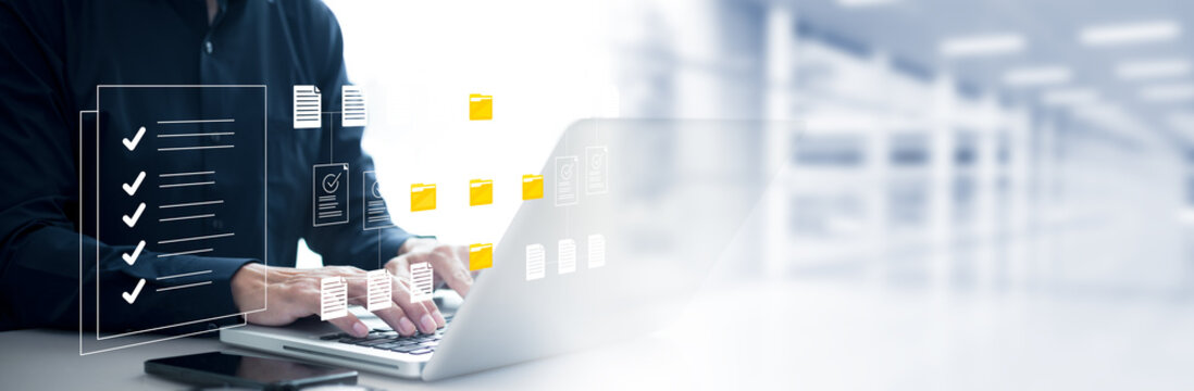 Man wearing touch icon folder. Online documentation database, IT consultant being set up Virtual Document Management System with laptop,Software for archiving corporate files.