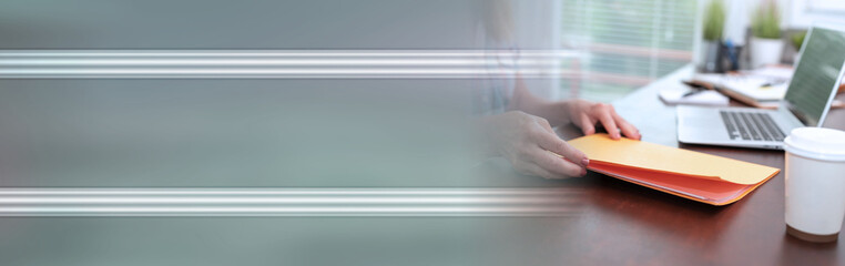 Businesswoman holding folder; panoramic banner