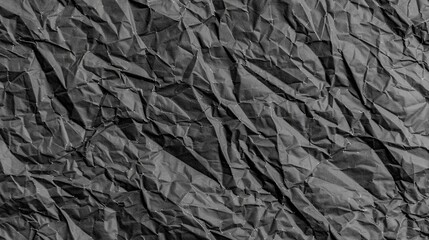 Flat lay, black sheet of paper. Start something from light scratch. Space for new creative ideas. Texture Of Crumpled black or grey Paper. Paper Texture Background.