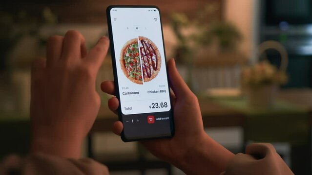 Customizing half-and-half pizza in an online delivery shop Making an online order in a fast food app. Fast food technology concept.