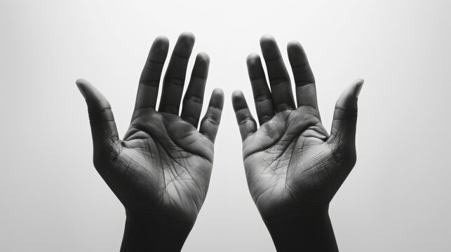 Two open empty hands with palms facing upward in black and white set against a white background - Powered by Adobe