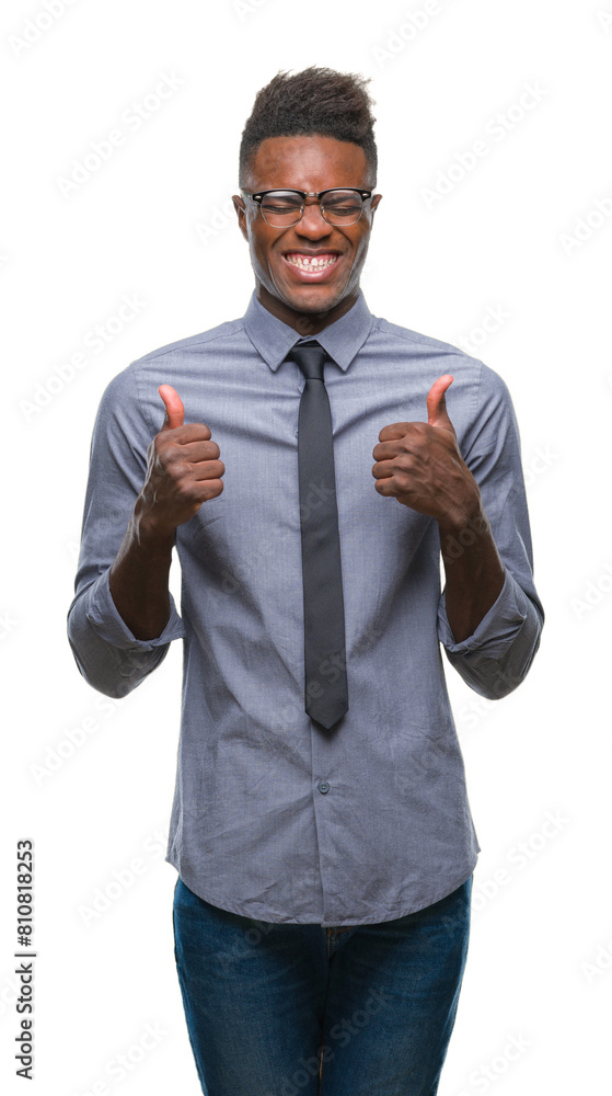 Wall mural Young african american business man over isolated background excited for success with arms raised celebrating victory smiling. Winner concept.