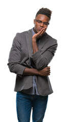 Fototapeta premium Young african american business man over isolated background thinking looking tired and bored with depression problems with crossed arms.