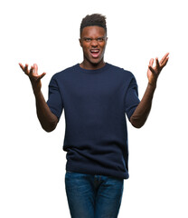 Fototapeta premium Young african american man over isolated background crazy and mad shouting and yelling with aggressive expression and arms raised. Frustration concept.