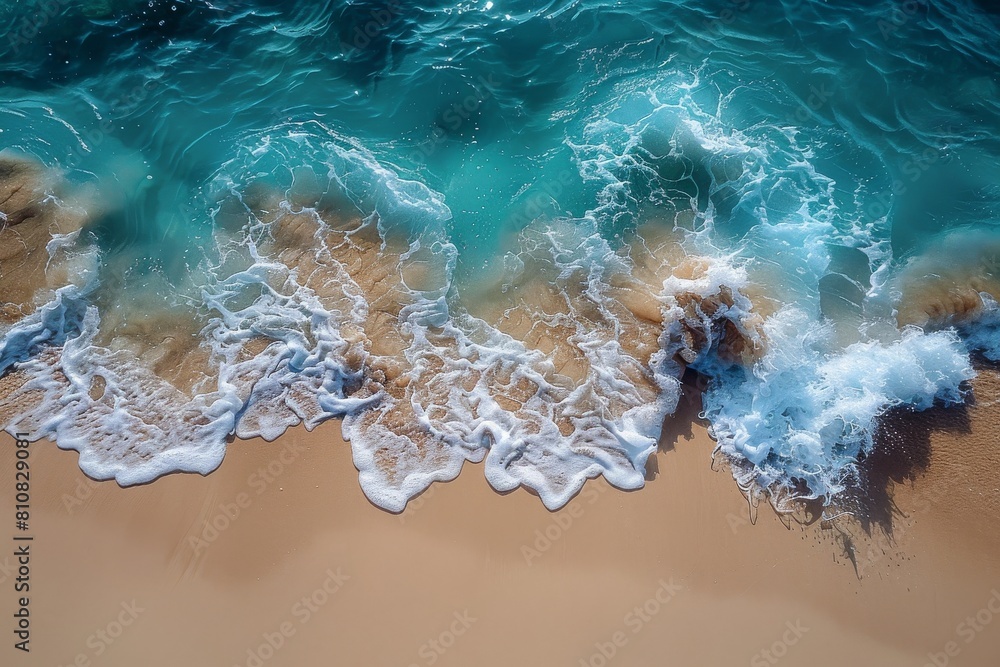 Poster a close-up shot capturing the dynamic interaction of foamy waves with the golden sand of a beautiful