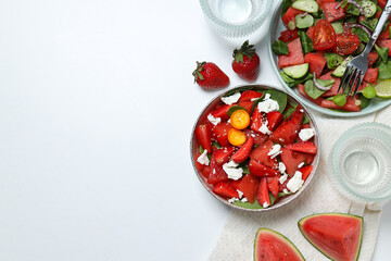 Watermelon salad in bowls with strawberries on a white background