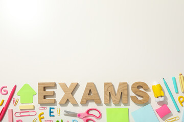 Exam, inscription on the table, on a light background.