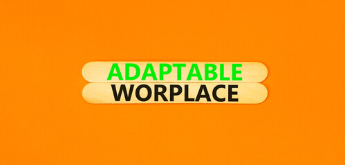 Adaptable workplace symbol. Concept words Adaptable workplace on beautiful wooden stick. Beautiful orange paper background. Business Adaptable workplace concept. Copy space.