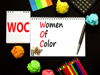 WOC women of color symbol. Concept words WOC women of color on beautiful white note. Beautiful...