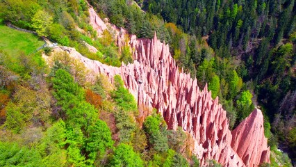 Upper Bolzano - Earth Pyramids - Aerial view of the glowing stone pyramids on the mountainside